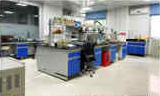 Two men inspecting a lab